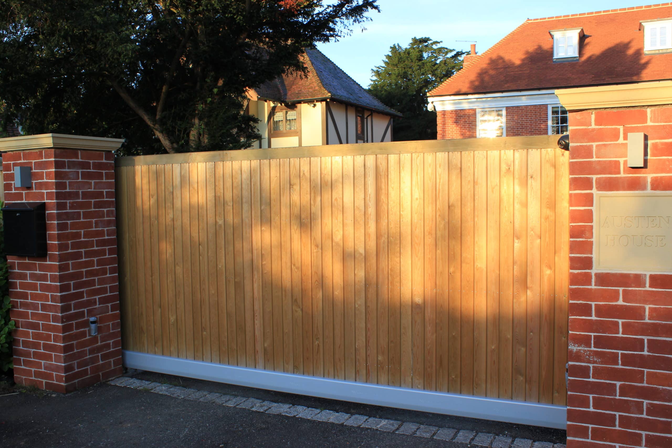 tracked sliding driveway entrance gate for automation
